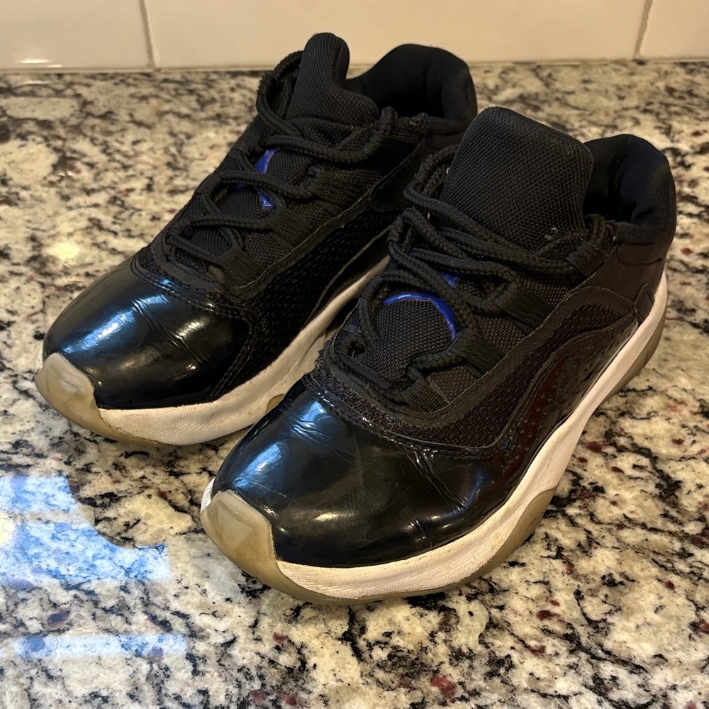 Kids Black Jordan 11s CMFT Sneakers